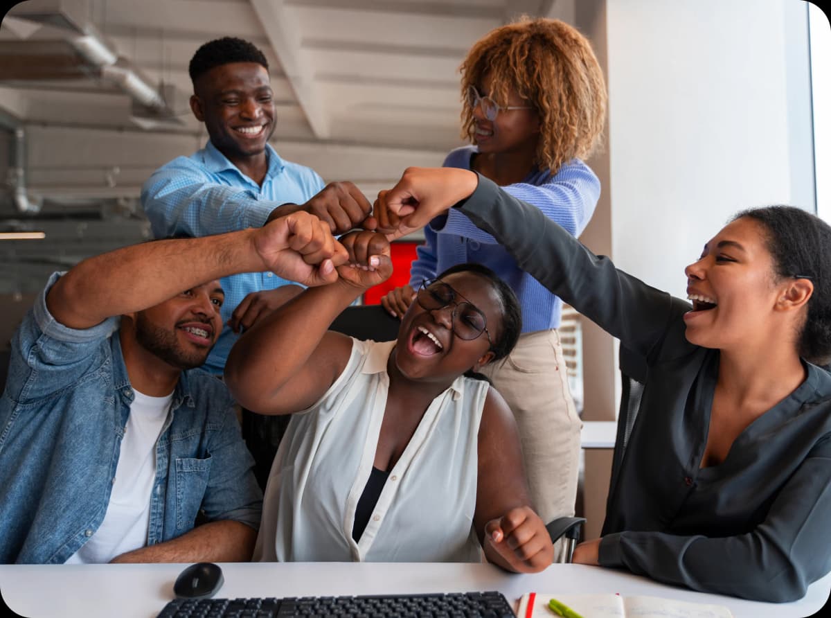 Team celebrating together in office